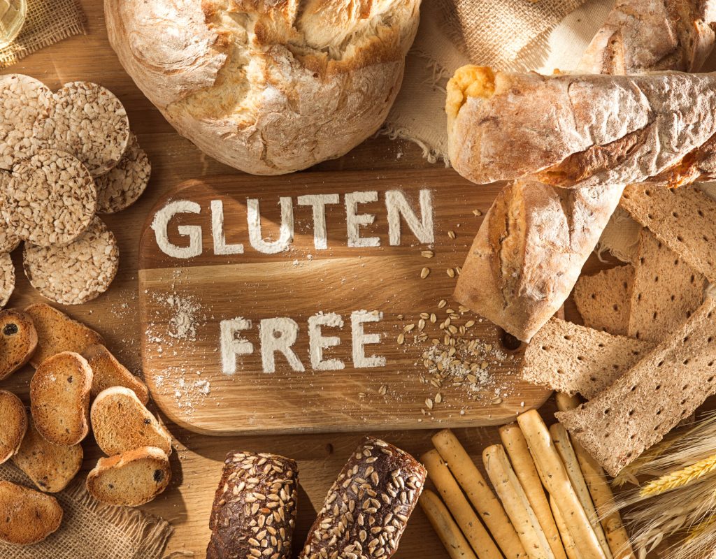 Gluten free food. Various pasta, bread and snacks on wooden background from top view. Healthy and diet concept.